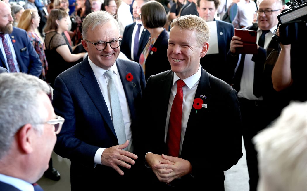 Australian Prime Minister Anthony Albanese and New Zealand Prime Minister Chris Hipkins chat after a Citizenship ceremony in Brisbane. Photo: AFP/Pat Hoelscher.