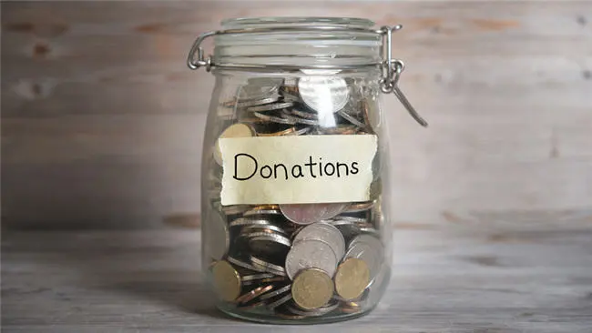 Coins in a donation jar (Photo: Google Images)